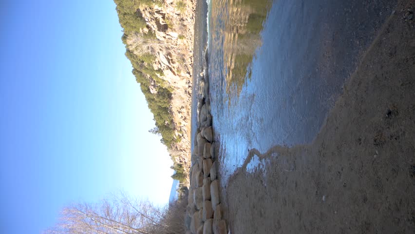 Buena Vista River Park shore in Colorado during the day with no people, vertical pan