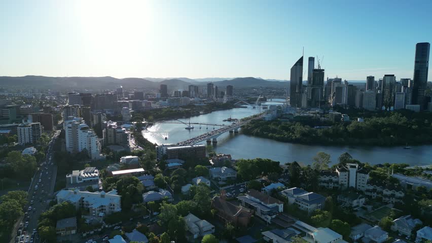 Establishing drone shot of Brisbane City. Flying towards South Bank from above Woolloongabba. South Bank, Brisbane River, Brisbane City and the M3 Express Way Motorway Captain Cook Bridge in shot.
