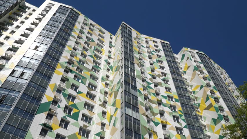 modern high-rise residential building with colored facades, close-up Royalty-Free Stock Footage #1104001681