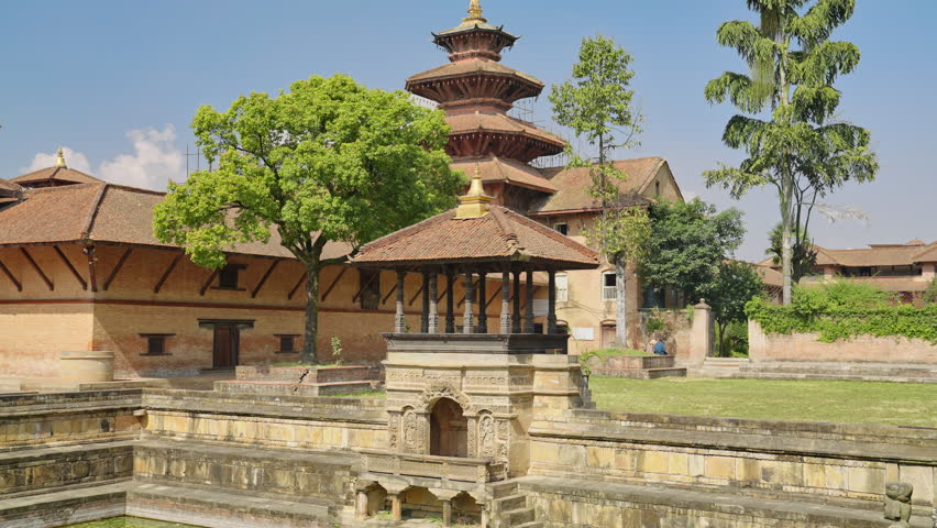 Bhandarkhal water tank and Royal Palace temples in historic Patan Durbar Square, Kathmandu Valley, Nepal