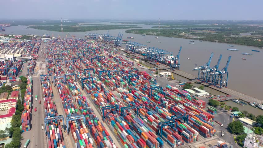 Ho Chi Minh city, Vietnam - May, 2023: Aerial drone view of Cat Lai port with cargo ship and container. Large import-export port important for economic development in Ho Chi Minh City, Vietnam