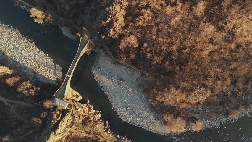 Scenic view on the nature in Corio, near Turin in Italy. charming scenic with hills, mountain river and bridge over it.
