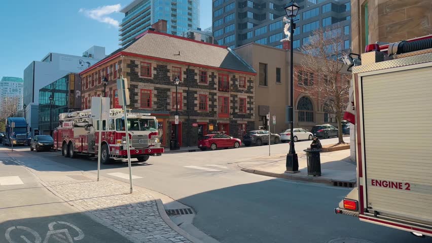 Fire Engine is on Call in Downtown Halifax Canada. Fire Truck With Flashing Lights and a Siren Rides a 911 Call. Firefighting and Victim Assistance Canada, Halifax 8. May. 2023.
