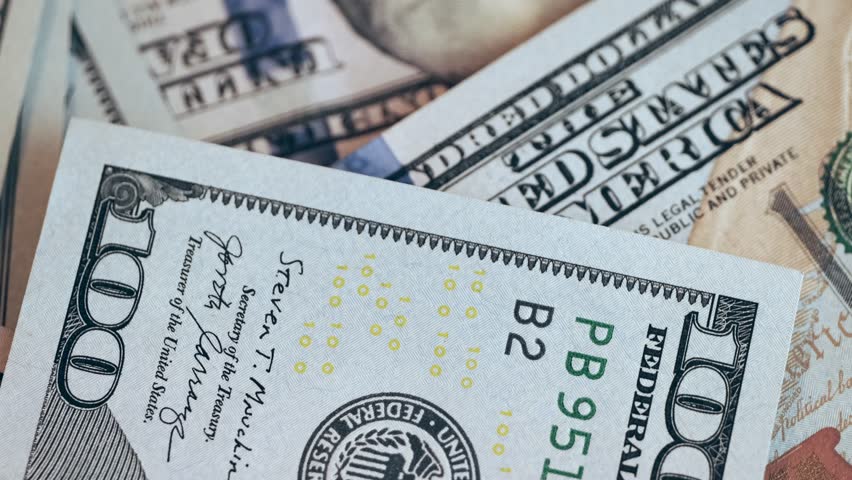 Close-up of dollars money rotate. Dollars banknotes value of 100. Hundred dollar bill close up in camera motion. 100 dollars Us banknotes. Cash of hundred dollar bills. Royalty-Free Stock Footage #1104019241