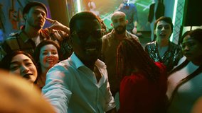 POV of funky people filming video at party, making memories on dance floor with friends at nightclub. Cheerful persons taking pictures and recording vlog at modern celebration. Handheld shot. - Powered by Shutterstock - Get 15% off with code: PIKWIZARD15