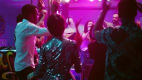 Smiling girl doing karaoke at club, singing songs at microphone and dancing with DJ on stage. Young man mixing music for crowd of people having fun and partying, dance party. Handheld shot. - Powered by Shutterstock - Get 15% off with code: PIKWIZARD15