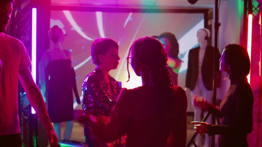 People partying interrupted by police officers, young adults seeing police sirens or lights and stopping the music. Men and women being afraid of law enforcement at nightclub. Handheld shot. | Shutterstock HD Video #1104023483