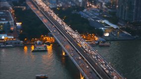 Speed video high view of transportation by boat on Chaopraya river and car on Taksin bridge in Bangkok,Thailand