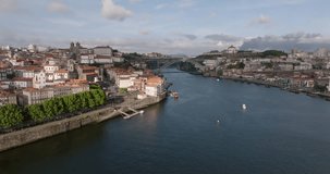 View of the city of Porto, the river Douro, Luis 1 bridge and the old center. Drone video.