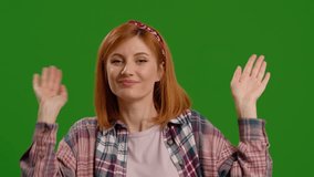 Happy smiling woman dancing and having fun on a green screen background. Female enjoying solance moving her body. - Powered by Shutterstock - Get 15% off with code: PIKWIZARD15