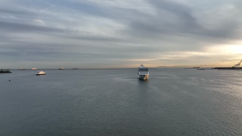 Aerial View of cruise ship in sea ocean water. Top view from drone of long beach CA. Aerial view of luxury cruise ship. Cruise Liners on cruise in the ocean sea. Tourism and travel.