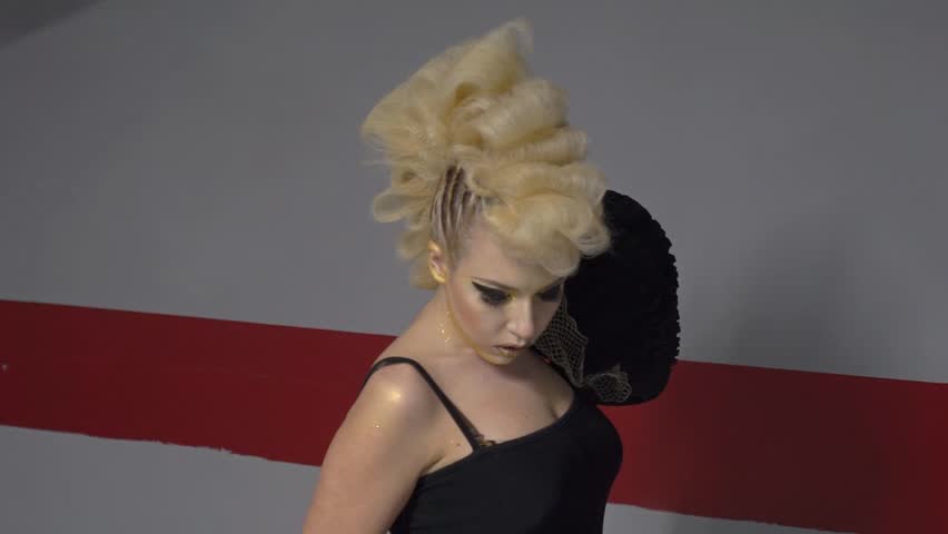 Slow Motion Beautiful punk girl posing in the parking lot