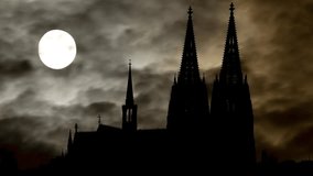 Cologne : Gothic Cathedral by Night with Dark Atmosphere, Fog, Smoke, and Full Moon, Germany - Powered by Shutterstock - Get 15% off with code: PIKWIZARD15