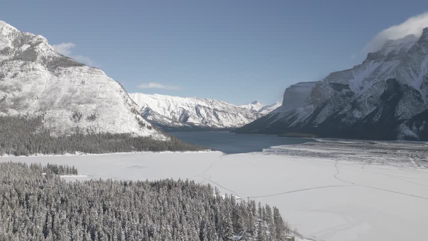 Aerial video flying over Banff National Park in winter