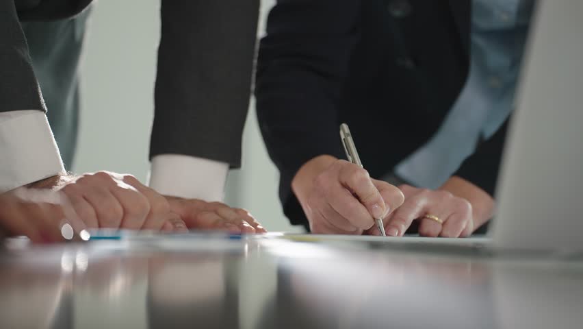 Close up hands of businesspeople team explaining financial of company on meeting table. Team of business working and discuss in office meeting room. Business meeting concept Royalty-Free Stock Footage #1104053359