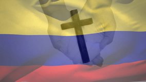 Animation of christian cross and flag of colombia. Christianity, faith and religion concept digitally generated video.