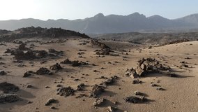 Aerial video at golden hour of Minas de San Jose park with dry Mars like landscape on Tenerife, Spain