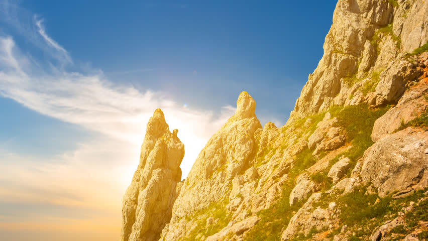 rocky mount slope at the dramatic sunset, natural mountinering time lapse scene