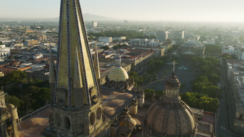 Drone flying backwards from Cathedral of Assumption of Our Lady in Centro Jalisco. Architectural masterpiece in Spanish Renaissance style with neo gothic spires 4K. Guadalajara Cathedral, Mexico 4K