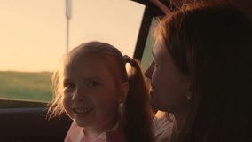 Passengers girl child, mother sit in car look out window on sunny day. Mother, little daughter smiling enjoy travel by car. Happy family enjoy car travel together, mother and child look out car window - Powered by Shutterstock - Get 15% off with code: PIKWIZARD15