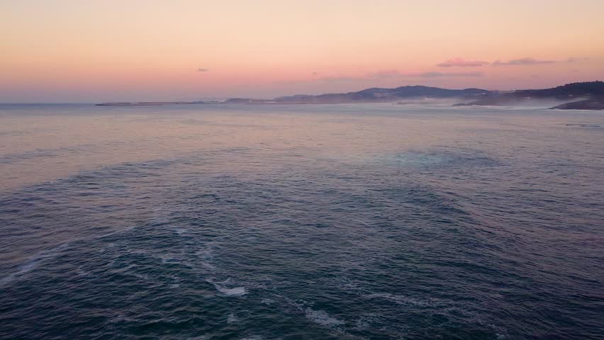 Captivating Sunset Over The Sea In Arteixo, A Coruna, Spain. aerial pan right