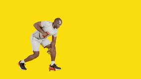 African sportive man doing kick triceps exercise