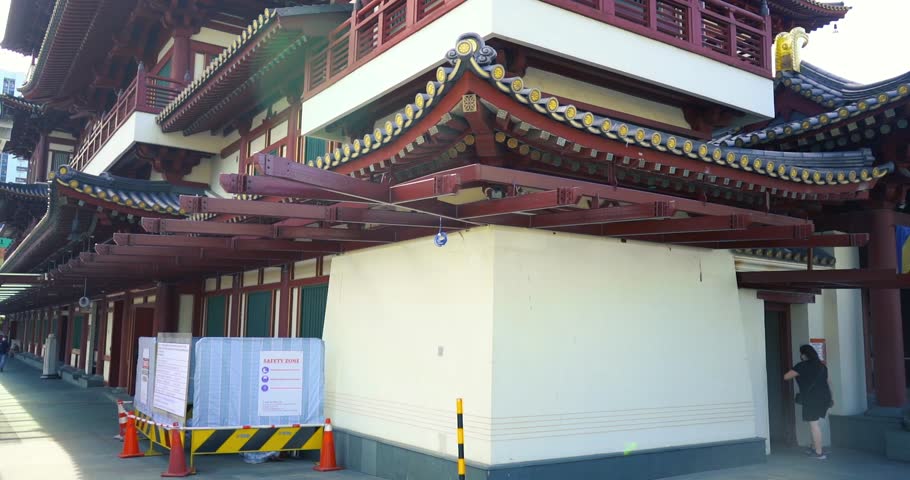 Buddha Tooth Relic Temple China Town, Slow motion shot of side of the temple, Mid day shot with sun flare, Singapore, Smooth 4k Footage
