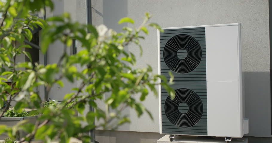Powerful heat pump for heating and air conditioning of a modern private house. Energy saving technology concept