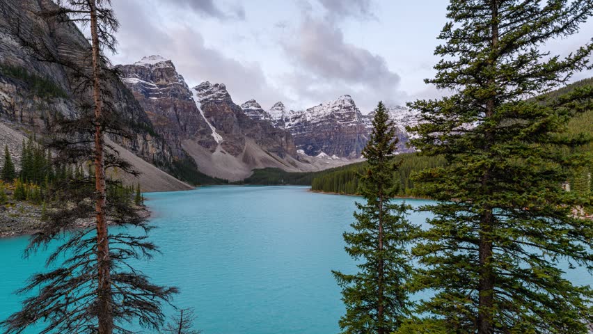 Time lapse of Beautiful scenery of Moraine Lake with Rocky Mountains and turquoise water in the morning on viewpoint at banff national park, AB, Canada