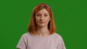 Beautiful young woman using interactive touch screen with various gestures isolated green screen background. Futuristic approaches in technology use by woman wireless. - Powered by Shutterstock - Get 15% off with code: PIKWIZARD15