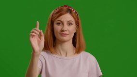Beautiful young woman using interactive touch screen with various gestures isolated green screen background. Futuristic approaches in technology use by woman wireless. - Powered by Shutterstock - Get 15% off with code: PIKWIZARD15