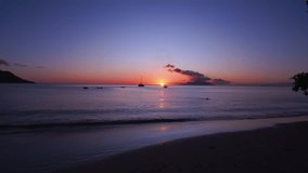 beautiful sunset on beau vallon beach, Mahe Seychelles, tourist swimming, calm sea and beautiful scenery 1