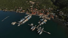 Coastal Beauty Unveiled: Mesmerizing Drone Footage of Kaleüçağız's Town, Port, and Serene Boats