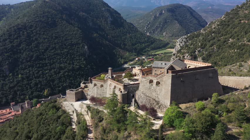 France, Eastern Pyrenees, Villefranche-de-Conflent, close to Perpignan, drone aerial view of the Fort Liberia overlooking the typical French village and its ramparts. Castle built by architect Vauban.
