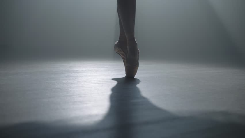 Close-up of the legs of a ballerina in pointe shoes dancing on the floor. Hard work and training in dancing and the art of classical choreography. High quality 4k footage Royalty-Free Stock Footage #1104096235