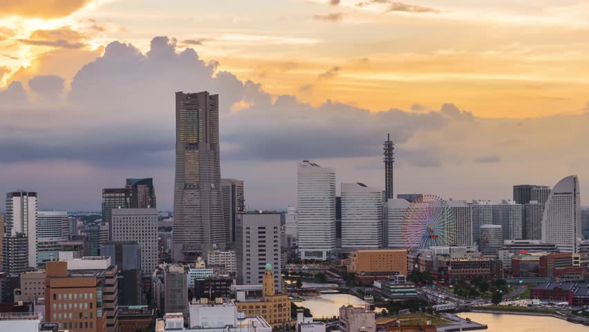 Yokohama, Japan cityscape of Minato Mirai District from dusk till night.