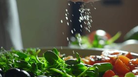 close up shot of salt falling super slow motion. cooking healthy dinner at home. well-balanced meal with vegetables, colorful vegetarian bowl - Powered by Shutterstock - Get 15% off with code: PIKWIZARD15
