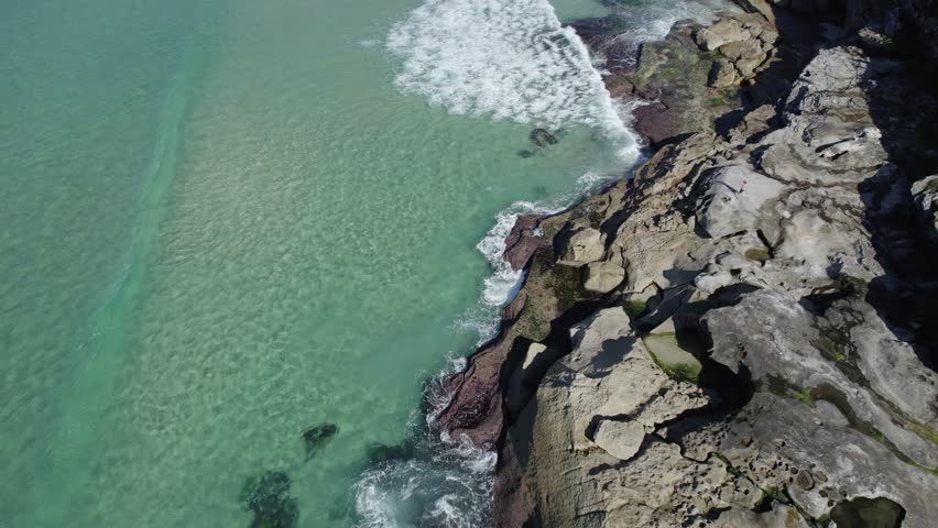 Ocean Waves At Bronte Beach With People Enjoying, Eastern Suburbs Of Sydney, Australia - aerial drone shot