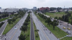 Video recorded in 4k with a drone on a Sunday on a bicycle path along Avenida el Dorado in Bogota