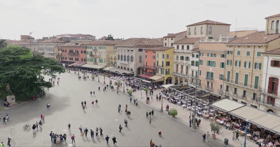 Tourists Walking Around The Piazza Bra With Eateries From The Arena In Italy. - wide