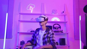 Portrait of esport man gamer using technology VR glasses and play game. Attractive young male gaming player taking off virtual reality headset, feel excited enjoy broadcast live streaming online game.