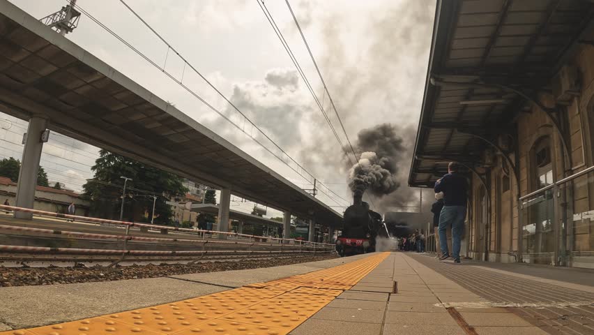 old locomotive with black smoke from chimney