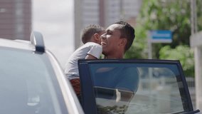 Father carries son on his arms outside the car 
 - Powered by Shutterstock - Get 15% off with code: PIKWIZARD15