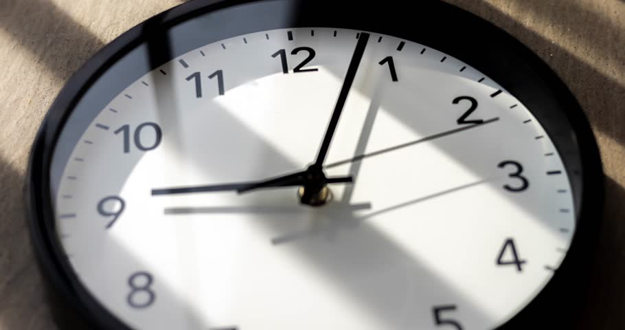 Wall clock show the running time. Time lapse on a modern wall clock.  Close up to a wall clock, with running time pointer. Sun and sky reflecting in the watch during the time passing by
 Royalty-Free Stock Footage #1104123561