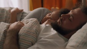 Happy Young Relaxed Couple Cuddling Together in Bed Sleeping at Night. Beautiful Girl and Handsome Boy Sleeping Together, Side View Shot, woman putting her hand on husband slow motion rest, weekend - Powered by Shutterstock - Get 15% off with code: PIKWIZARD15