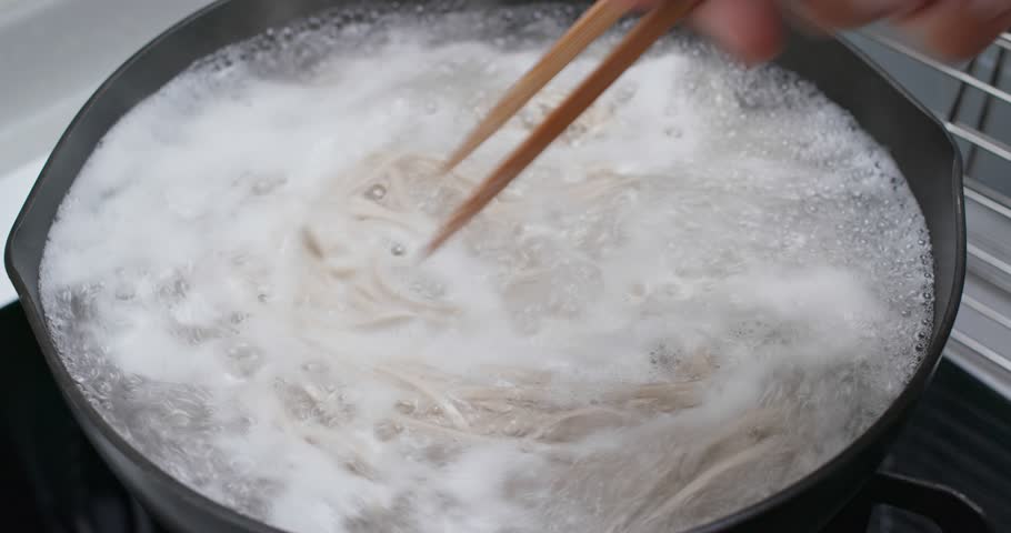 Cook with japanese soba in the kitchen close up Royalty-Free Stock Footage #1104129059