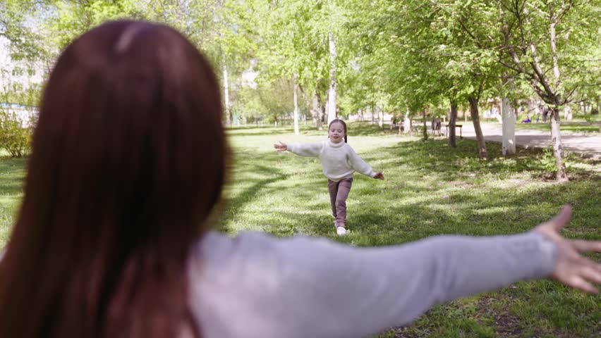 happy family park. mother hugs running cheerful child. portrait kid child girl smile. little daughter girl.happy cute affectionate mother hugging her little daughter. happy child kid hugging his Royalty-Free Stock Footage #1104130557