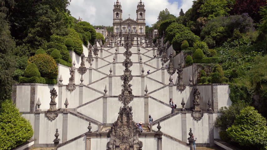 Aerial view of the Baroque stairway leading to the historic Sanctuary of Bom Jesus do Monte church in Braga, northern Portugal.  Royalty-Free Stock Footage #1104135923