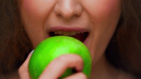 Portrait of Young Woman Eating Healthy Food on Camera. Crop Face of Alone Female Person on Diet Consuming Fresh Green Apple as Lunch Snack. Playful Real Human with Savory Organic Meal in Pretty Mouth - Powered by Shutterstock - Get 15% off with code: PIKWIZARD15