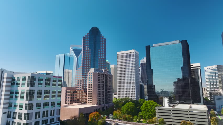 Urban landscape of downtown district of Charlotte city in North Carolina, USA. Skyline with high skyscraper buildings in modern american megapolis